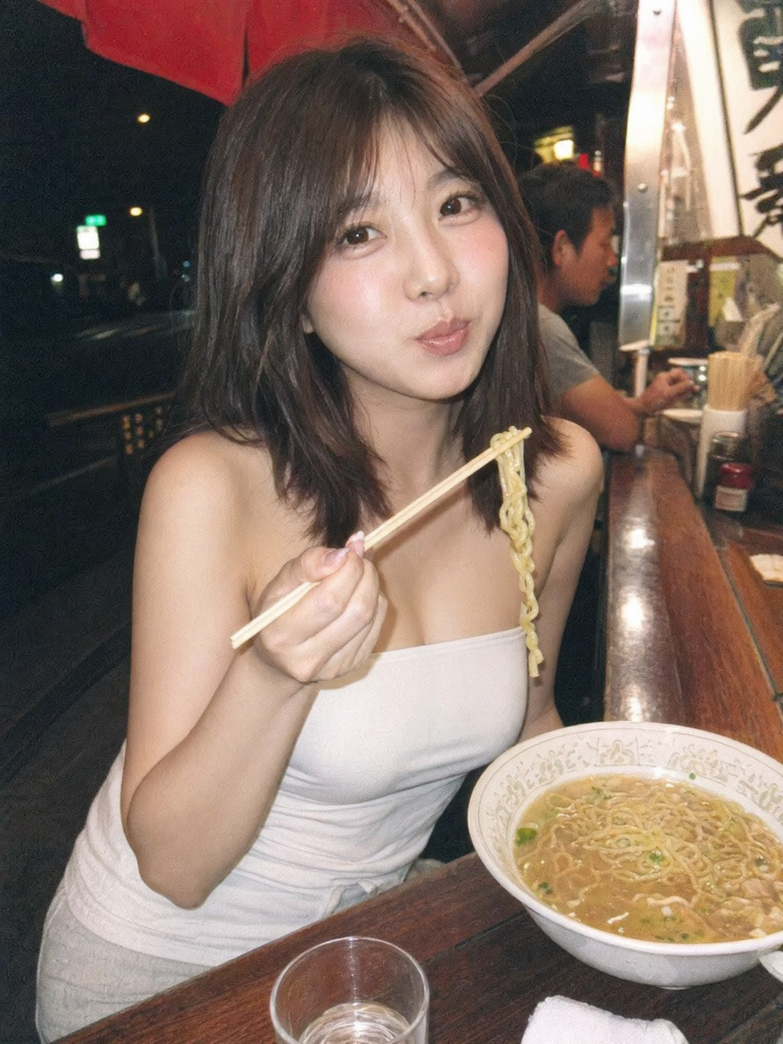 photorealistic image of the woman in the reference image smiling cutely while e...